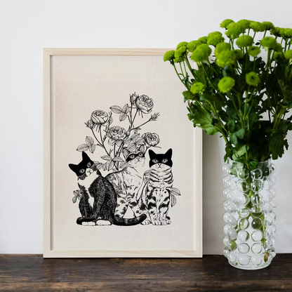 Three cats and flowers